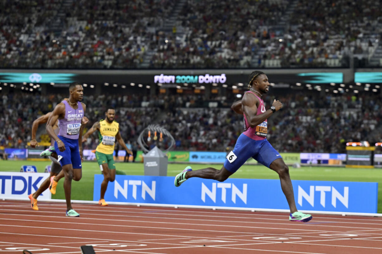 Noah Lyles, of the United States, leads the pack to win the Men's 200-meters final during the World Athletics Championships in Budapest, Hungary, Friday, Aug. 25, 2023.