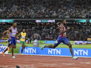 Noah Lyles, of the United States, leads the pack to win the Men's 200-meters final during the World Athletics Championships in Budapest, Hungary, Friday, Aug. 25, 2023.