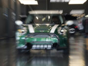 An unsold 2024 Cooper S hardtop sits in a Mini dealership Friday, July 21, 2023, in Highlands Ranch, Colo. Car insurance and repair costs have been rising sharply because new and used car prices soared amid shortages of chips and parts in the aftermath of the pandemic.