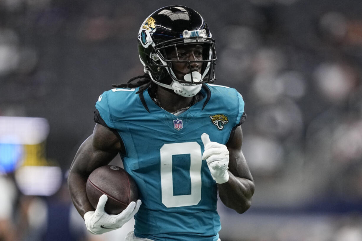 Jacksonville Jaguars wide receiver Calvin Ridley (0) runs drills before an NFL preseason football game against the Dallas Cowboys, Saturday, Aug. 12, 2023, in Arlington, Texas.