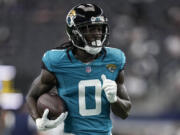 Jacksonville Jaguars wide receiver Calvin Ridley (0) runs drills before an NFL preseason football game against the Dallas Cowboys, Saturday, Aug. 12, 2023, in Arlington, Texas.