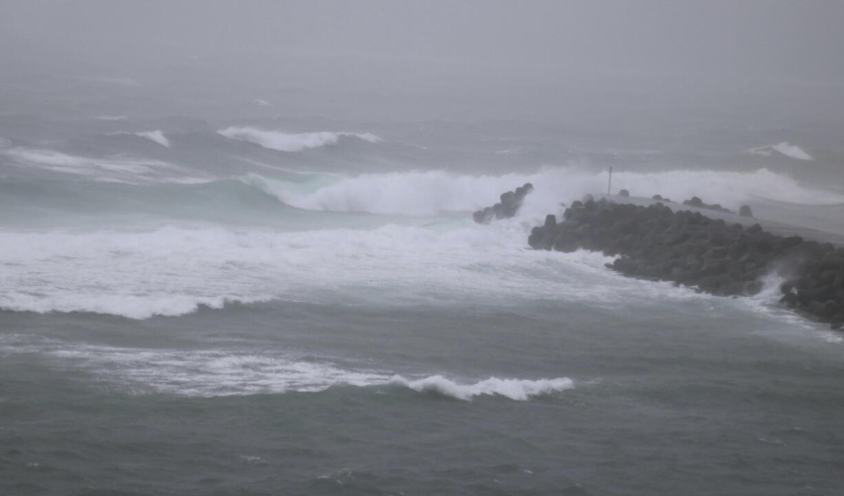 High waves caused by approaching Tropical Storm Khanun hit a port on Amami Oshima Island, Kagoshima prefecture, southern Japan Monday, Aug. 7, 2023.