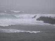 High waves caused by approaching Tropical Storm Khanun hit a port on Amami Oshima Island, Kagoshima prefecture, southern Japan Monday, Aug. 7, 2023.