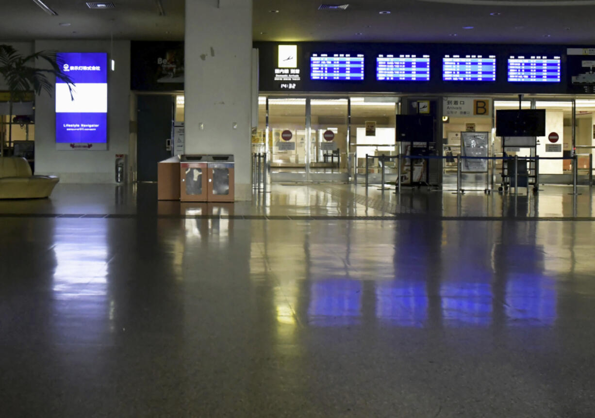 Naha airport is deserted as it is closed due to approaching typhoon in Naha, Okinawa, southern Japan, Wednesday, Aug. 1, 2023. Hundreds of flights into and out of the Naha airport, including a more than a dozen international flights connecting Seoul, Hong Kong, Taipei and Shanghai, were canceled, according to the airport.