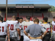 Western Oregon players gather during NCAA college football practice, Wednesday, Aug. 9, 2023, in Monmouth, Ore. As one of just two Division II schools with football teams in on the West Coast, Western Oregon spends hundreds of thousands of dollars in travel expenses to compete in the Lone Star Conference against schools in Texas and New Mexico.