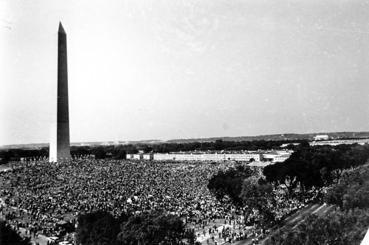 FILE - Civil rights demonstrators gather on the Washington Monument grounds in Washington Aug. 28, 1963.