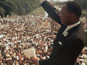 FILE - The Rev. Martin Luther King, Jr. acknowledges the crowd outside the Lincoln Memorial for his "I Have a Dream" speech during the March on Washington on Aug. 28, 1963.