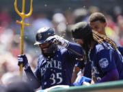 Seattle Mariners designated hitter Teoscar Hernandez (35) celebrates after hitting a home run during the seventh inning of a baseball game against the Los Angeles Angels in Anaheim, Calif., Sunday, Aug. 6, 2023.