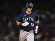 Seattle Mariners' Cade Marlowe runs the bases on a grand slam against the Los Angeles Angels during the ninth inning of a baseball game Thursday, Aug. 3, 2023, in Anaheim, Calif.