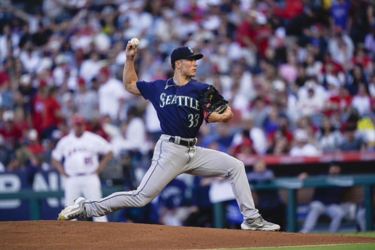 Seattle Mariners starting pitcher Bryan Woo delivers during the first inning of the team's baseball game against the Los Angeles Angels, Thursday, Aug. 3, 2023, in Anaheim, Calif.