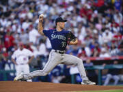 Seattle Mariners starting pitcher Bryan Woo delivers during the first inning of the team's baseball game against the Los Angeles Angels, Thursday, Aug. 3, 2023, in Anaheim, Calif.