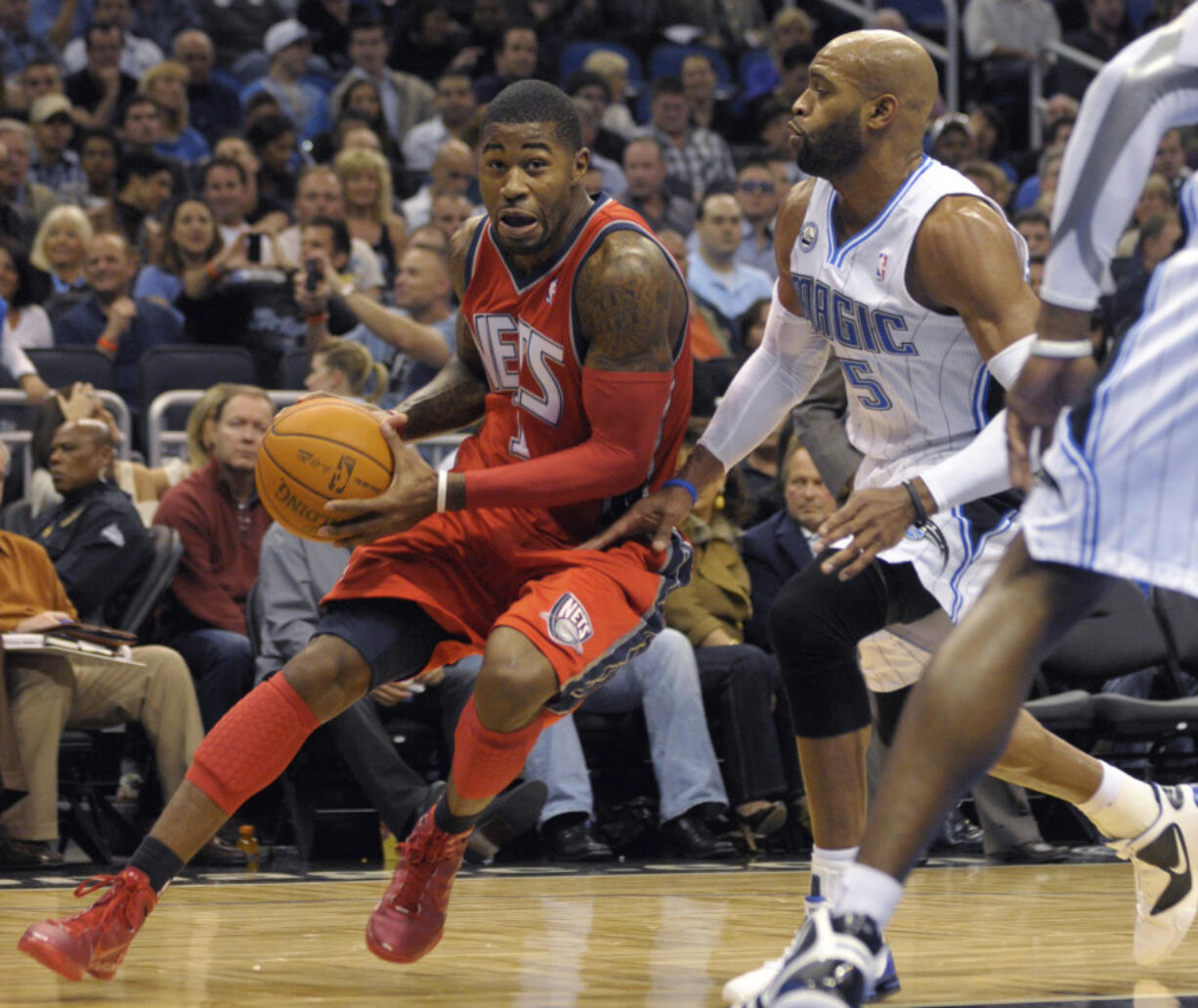 A federal judge sentenced a former first-round NBA draft pick Terrence Williams, left, to 10 years in prison Thursday, Aug. 3, 2023, saying he used his people skills to entice others to aid his $5 million health care fraud after he "frittered away" substantial earnings from his professional career. (AP Photo/Phelan M.