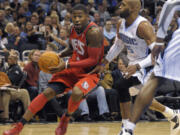 A federal judge sentenced a former first-round NBA draft pick Terrence Williams, left, to 10 years in prison Thursday, Aug. 3, 2023, saying he used his people skills to entice others to aid his $5 million health care fraud after he "frittered away" substantial earnings from his professional career. (AP Photo/Phelan M.