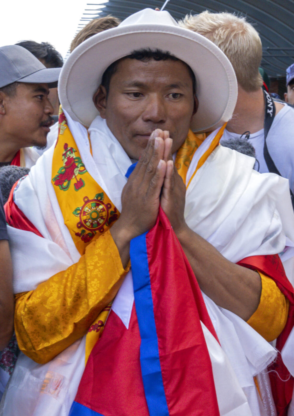 Nepali sherpa guide Tenjen Sherpa, 35, who with Norwegian climber Kristin Harila climbed the world's 14 tallest mountains in record time, arrives Aug. 5 in Kathmandu, Nepal.