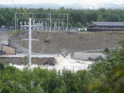 The Braskreidfoss Power plant is pictured in Braskereidfoss, Norway, Wednesday, Aug. 9, 2023. Authorities in Norway are considering blowing up a dam at risk of bursting after days of heavy rain to prevent downstream communities from getting deluged. The Glama, Norway's longest and most voluminous river, is dammed at the the Braskereidfoss hydroelectric power plant, which was under water and out of operation on Wednesday.