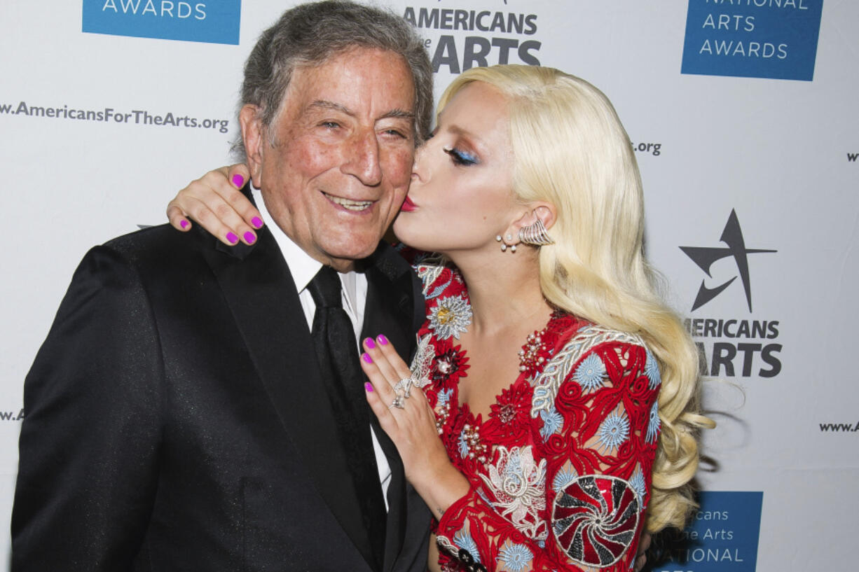 Tony Bennett, left, and Lady Gaga appear at the Americans for the Arts 2015 National Arts Awards in New York on Oct. 19, 2015. Bennett died Friday, July 21 at age 96.