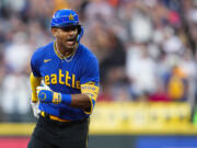 Seattle Mariners' Julio Rodríguez yells as he runs the bases on a three-run home run against the Baltimore Orioles during the fourth inning of a baseball game Friday, Aug. 11, 2023, in Seattle.