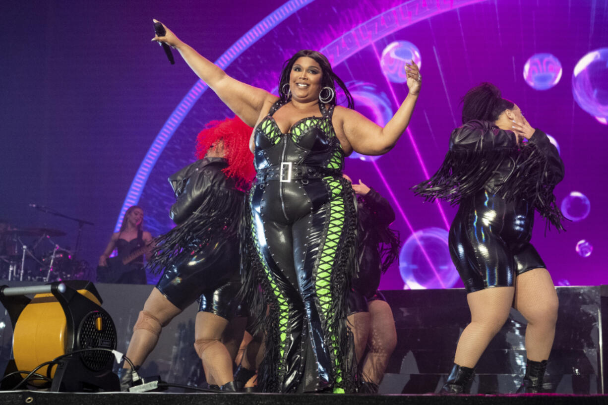 FILE - Lizzo performs at the BottleRock Napa Valley Music Festival on May 27, 2023, in Napa, Calif. Lizzo has been sued by three former dancers who accuse the Grammy winner of sexual harassment and allege the singer and her production company created a hostile work environment. The civil lawsuit filed Tuesday, Aug. 1, 2023, in Los Angeles County Superior Court claims Lizzo pressured one of the dancers to engage with nude performers at a club in Amsterdam and shamed another dancer for her weight gain before firing her.