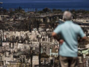 A man views the aftermath of a wildfire in Lahaina, Hawaii, Saturday, Aug. 19, 2023. (AP Photo/Jae C.