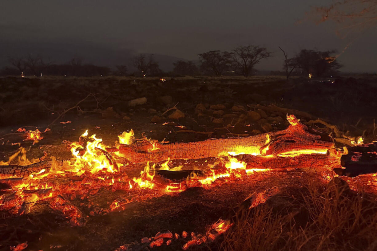 A wildfire burns in Kihei, Hawaii late Wednesday, Aug. 9, 2023. Thousands of residents raced to escape homes on Maui as blazes swept across the island, destroying parts of a centuries-old town in one of the deadliest U.S. wildfires in recent years.