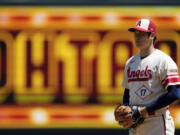 Los Angeles Angels starting pitcher Shohei Ohtani gets set to pitch during the first inning in the first baseball game of a doubleheader against the Cincinnati Reds Wednesday, Aug. 23, 2023, in Anaheim, Calif. (AP Photo/Mark J.