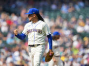 Seattle Mariners starting pitcher Luis Castillo walks off the field after pitching through the seventh inning of a baseball game against the Kansas City Royals, Sunday, Aug. 27, 2023, in Seattle.