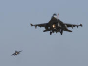 FILE - U.S. Air Force F-16 fighter jets fly over the Osan U.S. Air Base during a combined air force exercise with the United States and South Korea in Pyeongtaek, South Korea, Dec. 4, 2017. The U.S. has once again buckled under pressure from European allies and Ukraine's leaders and agreed to provide more sophisticated weapons to the war effort. This time it's all about F-16 fighter jets.