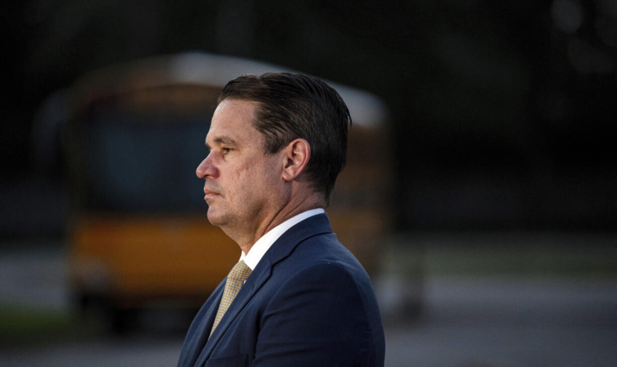 Jefferson County Public Schools Superintendent Marty Pollio waits at the Detrick Bus Compound on the first day of school on Wednesday, Aug. 9, 2023 in Louisville, Ky. An overly-ambitious redesign of bus routes for Louisville's school district turned into a logistical meltdown on the first day of classes, forcing schools to close as administrators said Friday, Aug. 11, 2023 that students may have to stay home into part of next week until the mess is untangled.