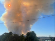 A plume of smoke rises from the Gray Fire, which forced evacuation of the city of Medical Lake and closed Interstate 90 west of Spokane.