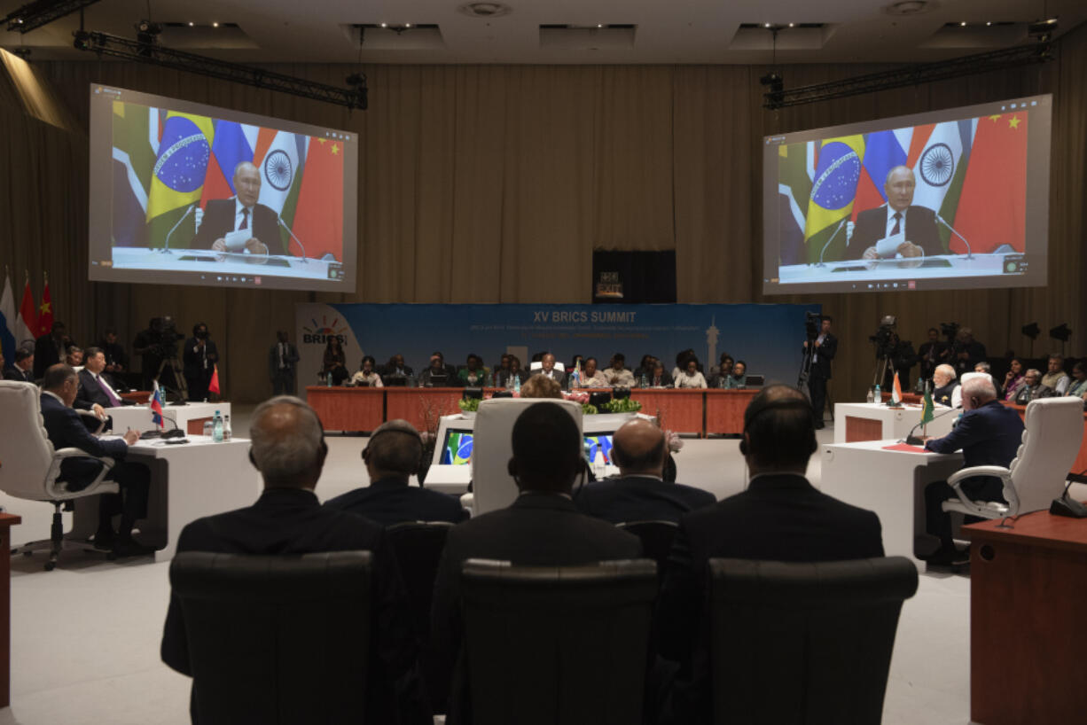 Russian President Putin addresses the BRICS summit via video link,  in Johannesburg, South Africa, Wednesday, Aug. 23, 2023.