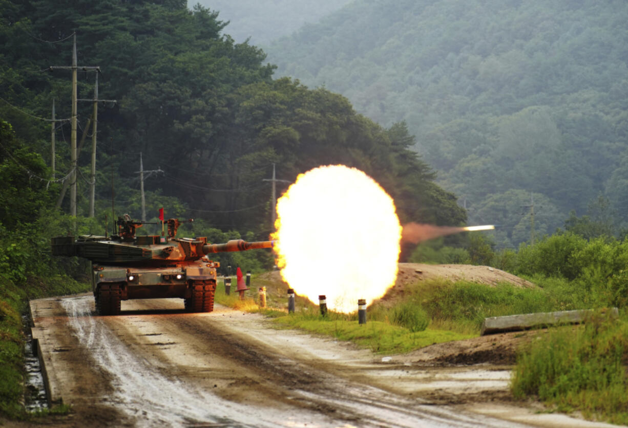 In this photo provided by South Korea Defense Ministry, a South Korean army's K1A2 tank fires during a drill as part of South Korea and the United States' joint annual military exercise, the Ulchi Freedom Shield, at a training filed in Cheorwon, South Korea, Wednesday, Aug. 30, 2023.