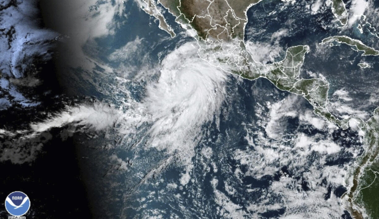 This satellite image taken at 10:50am EDT on Thursday, Aug. 17, 2023, and provided by the National Oceanic and Atmospheric Administration (NOAA) shows Hurricane Hilary off the Pacific coast of Mexico.