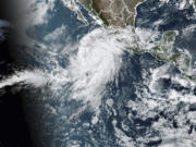 This satellite image taken at 10:50am EDT on Thursday, Aug. 17, 2023, and provided by the National Oceanic and Atmospheric Administration (NOAA) shows Hurricane Hilary off the Pacific coast of Mexico.