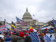 FILE - Rioters loyal to President Donald Trump rally at the U.S. Capitol in Washington on Jan. 6, 2021.