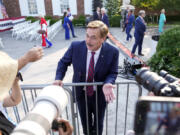 FILE - MyPillow CEO Mike Lindell talks to reporters before former President Donald Trump speaks at Trump National Golf Club in Bedminster, N.J., Tuesday, June 13, 2023, after pleading not guilty in a Miami courtroom earlier in the day to dozens of felony counts that he hoarded classified documents and refused government demands to give them back.