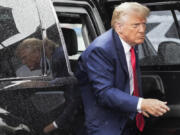 FILE - Former President Donald Trump arrives to board his plane at Ronald Reagan Washington National Airport, Aug. 3, 2023, in Arlington, Va., after facing a judge on federal conspiracy charges that allege he conspired to subvert the 2020 election. Trump and his legal team face long odds in their bid to move his 2020 election conspiracy trial out of Washington. They argue the Republican former president can't possibly get a fair trial in the overwhelmingly Democratic nation's capital.