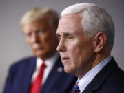 FILE - Vice President Mike Pence speaks alongside President Donald Trump during a coronavirus task force briefing at the White House in Washington on March 22, 2020. Former Vice President Mike Pence is refuting claims from ex-President Donald Trump's legal team that Trump never asked him to reject votes from certain states while certifying the 2020 election.