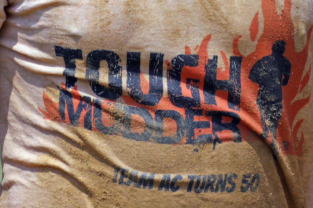 A general view of signage at the Tough Mudder Long Island at the Old Bethpage Village Restoration on July 22, 2017, in Old Bethpage, New York.