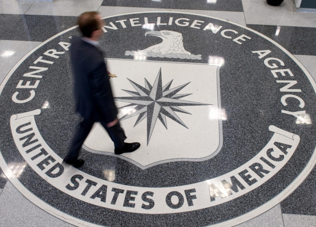 A man crosses the Central Intelligence Agency (CIA) seal in the lobby of CIA Headquarters in Langley, Virginia, on Aug. 14, 2008.