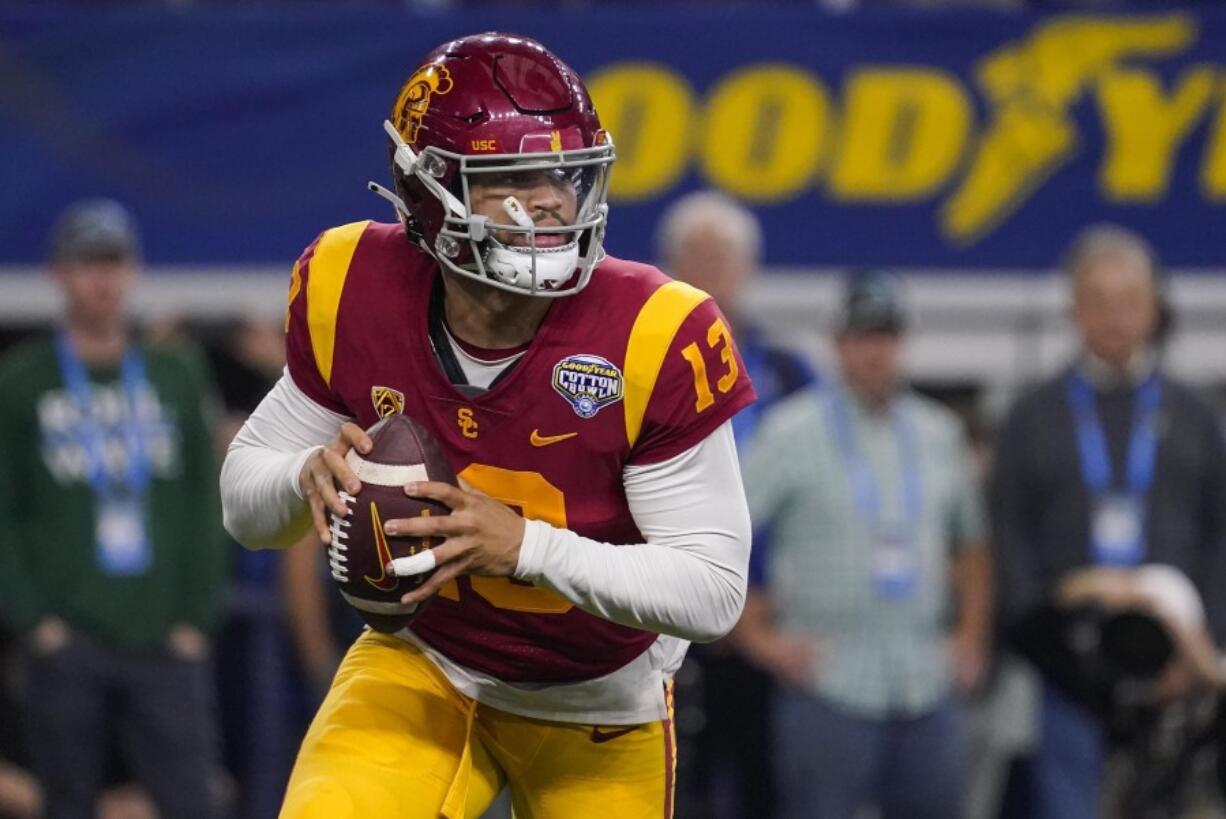 FILE - Southern California quarterback Caleb Williams (13) looks to pass during the first half of the Cotton Bowl NCAA college football game against Tulane, Monday, Jan. 2, 2023, in Arlington, Texas. USC opens their season at home against San Jose State on Aug. 26.