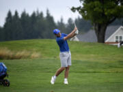 Ridgefield's Drew Krsul hits a shot from the fairway of the No. 5 hole at Tri-Mountain Golf Course during a match against Union on Monday, Aug. 28, 2023. Krsul was the medalist with a 45 as Ridgefield won 188-192.