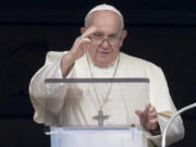 Pope Francis delivers his blessing as he recites the Angelus noon prayer from the window of his studio overlooking St.Peter's Square, at the Vatican, Sunday, Aug. 27, 2023.