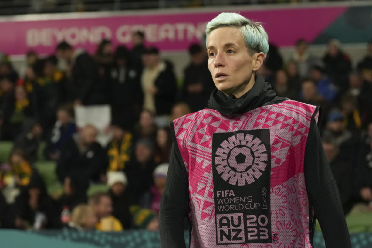 United States' Megan Rapinoe warms up on the sideline during the Women's World Cup round of 16 soccer match between Sweden and the United States in Melbourne, Australia, Sunday, Aug. 6, 2023.