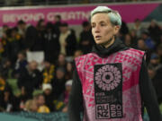 United States' Megan Rapinoe warms up on the sideline during the Women's World Cup round of 16 soccer match between Sweden and the United States in Melbourne, Australia, Sunday, Aug. 6, 2023.