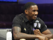 FILE  -Washington quarterback Michael Penix Jr. smiles at the Pac-12 NCAA college football media day, Friday, July 21, 2023, in Las Vegas. Washington opens their season at home against Boise State on Sept.