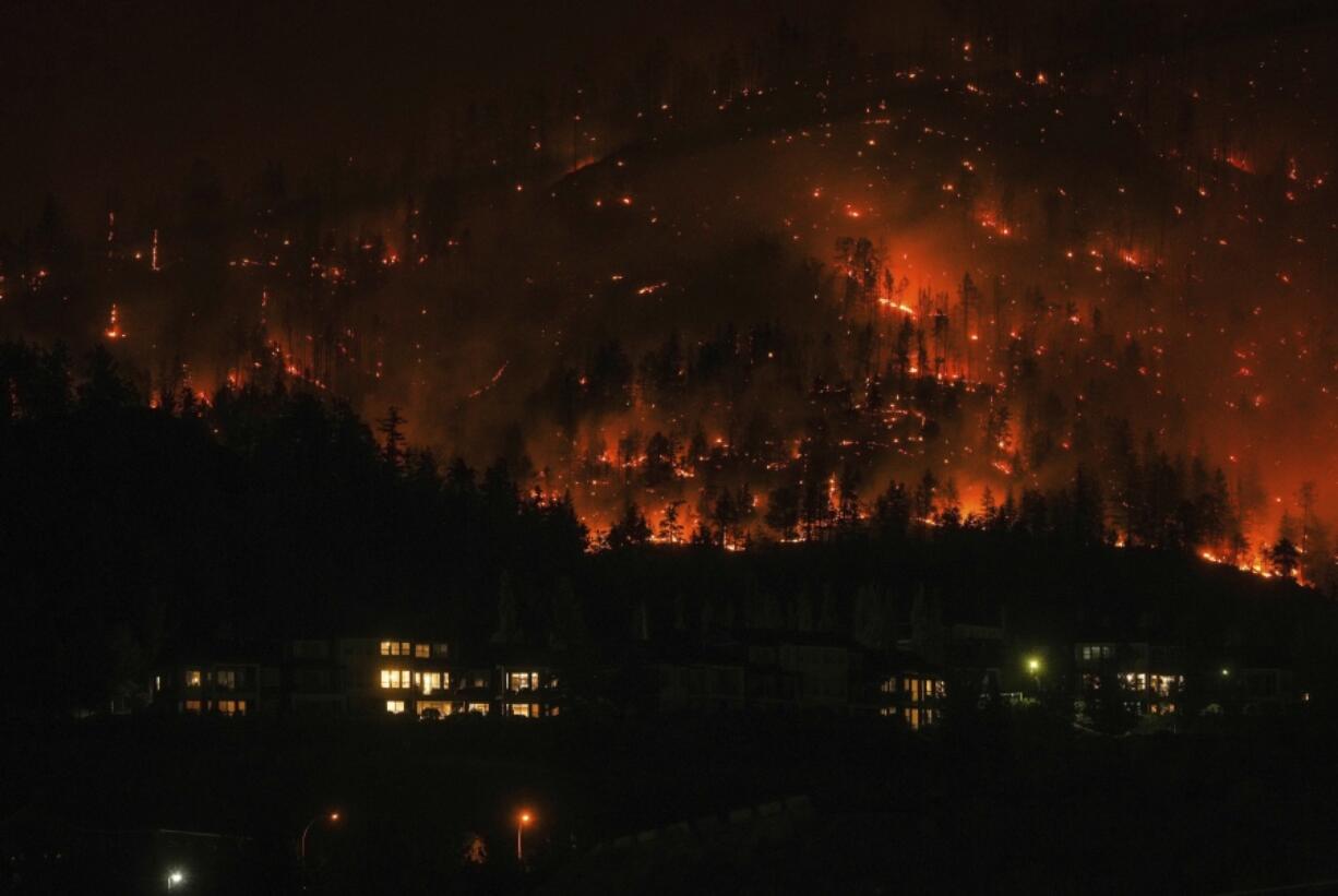 The McDougall Creek wildfire burns on the mountainside in West Kelowna, British Columbia, on Aug.18.