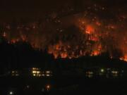 The McDougall Creek wildfire burns on the mountainside in West Kelowna, British Columbia, on Aug.18.