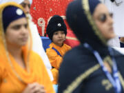 Members of the Sikh community participate in the Parliament of World Religion Parade of Faiths, Sunday, Aug. 13, 2023, in Chicago.