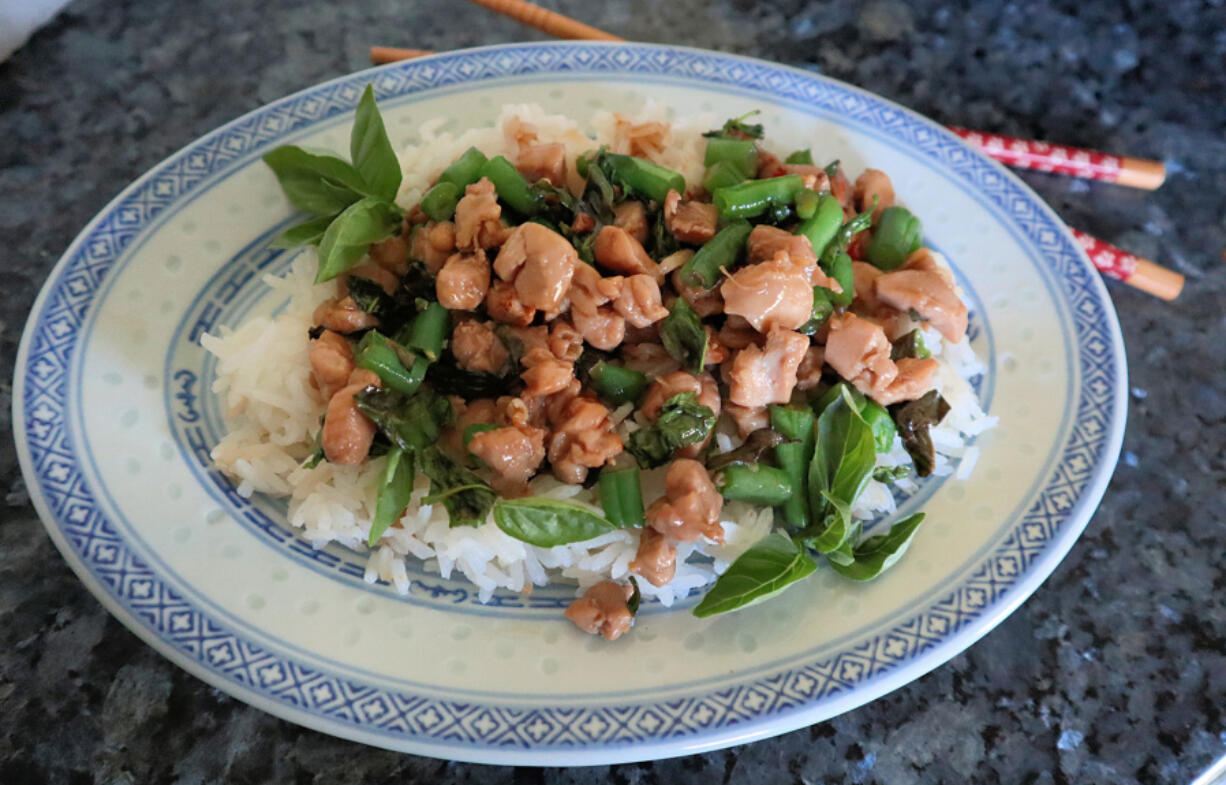 This easy, Thai-inspired chicken stir-fry makes good use of two favorite summer farmers market finds, basil and chili peppers.