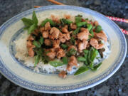 This easy, Thai-inspired chicken stir-fry makes good use of two favorite summer farmers market finds, basil and chili peppers.